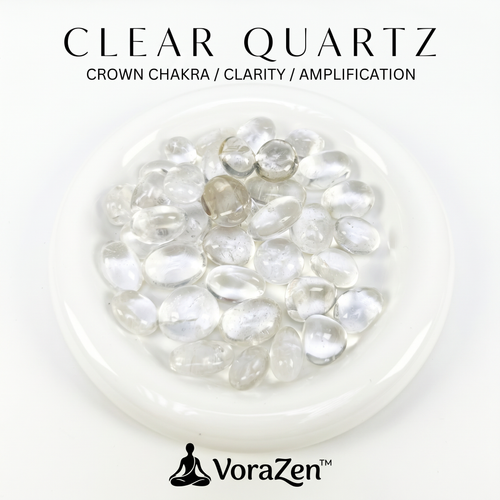 VoraZen™ Premium Clear Quartz Tumbled Stones in a white porcelain bowl. These high-clarity natural crystals, sized 15-18mm, are known as the "Master Healer." Features a brilliant transparent finish, perfect for amplifying energy, cleansing other crystals, and meditation.